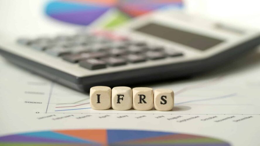International Financial Reporting Standards (IFRS) with copy space and calculator