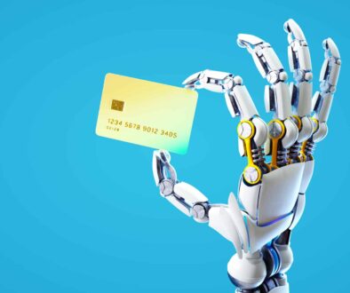 Robotic hand holding credit card