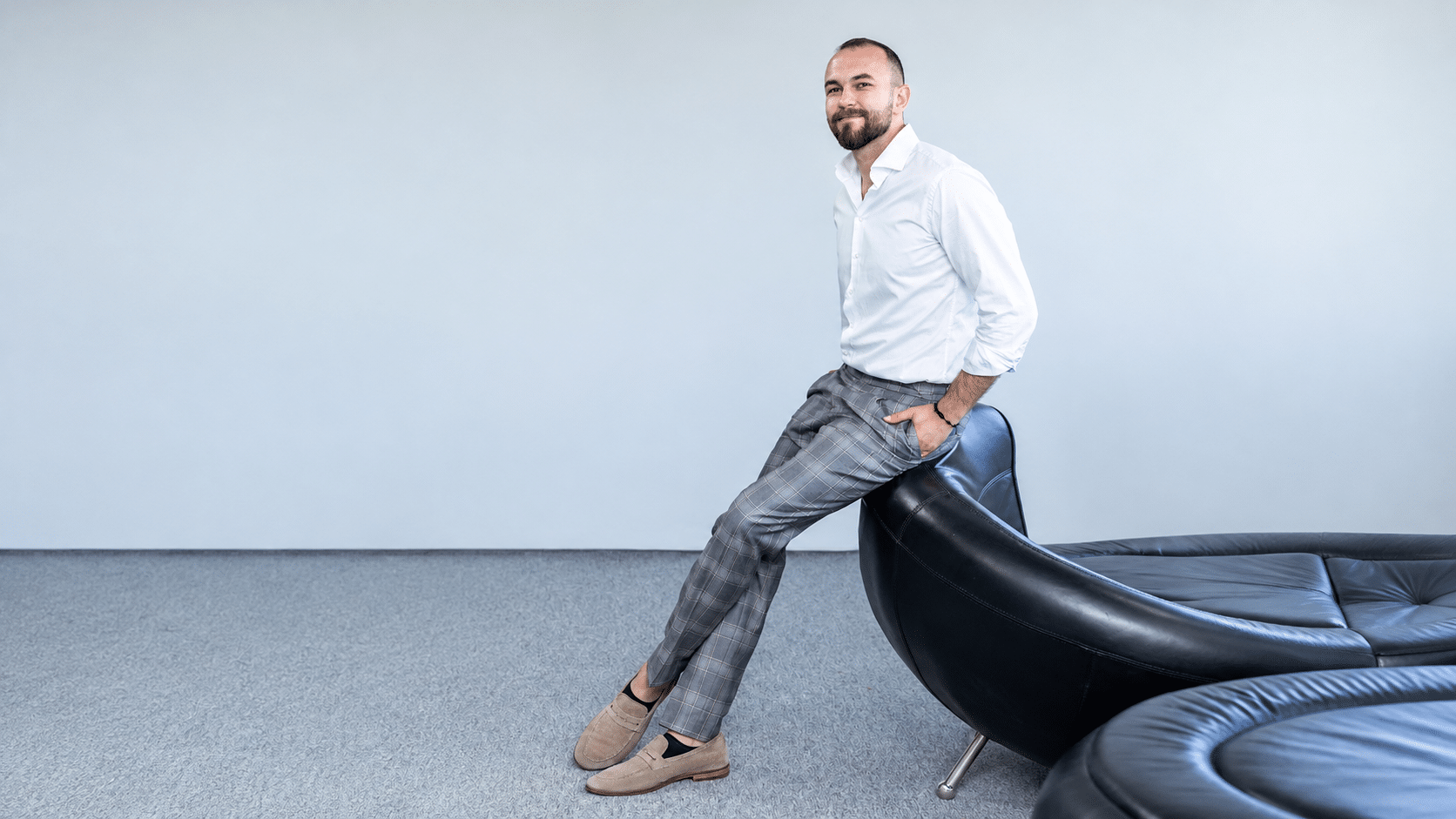 Minimalist Studio Portrait with Black Leather Seating